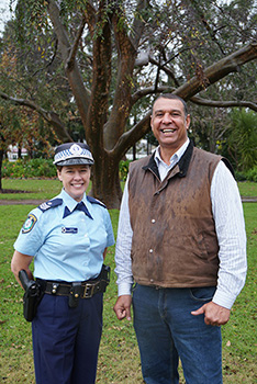 Photo of police officer and another person smiling