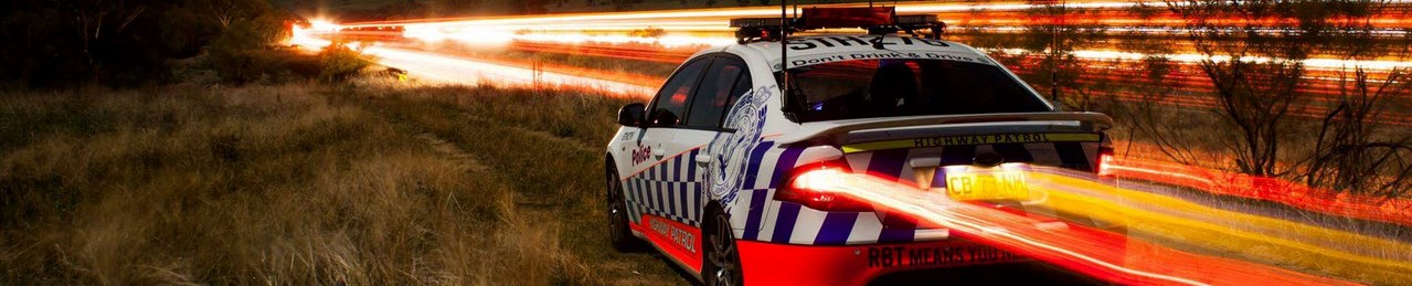 Long exposure photo of Highway Patrol car 