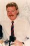 Portrait of Paul Burt wearing a shirt and tie